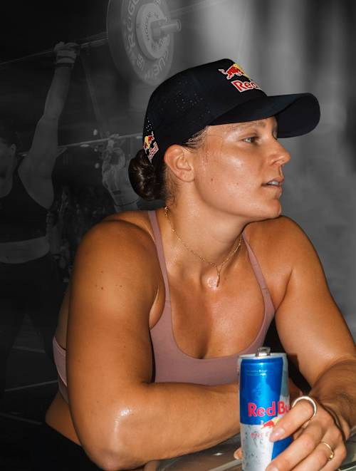 Laura Horváth takes a break from elite fitness training to drink a Red Bull