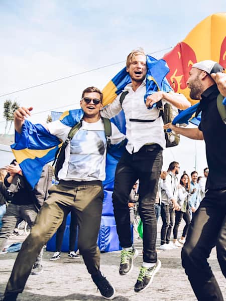 Gustav Seidel, Isac Ottosson and Tobias Andersson are ecstatic at the finish of the 2018 edition of Red Bull Can You Make It? in Amsterdam, the Netherlands.