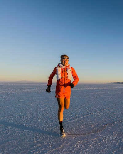 Fernanda Maciel runs towards the camera during her crossing of the Salar de Uyuni, Bolivia in September 2026.