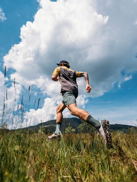 German ultrarunner Florian Neuschwander runs in the countryside.