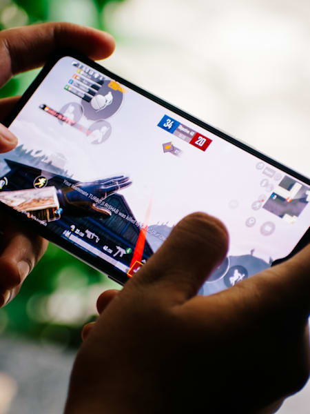 A gamer plays PUBG Mobile on a realme phone.