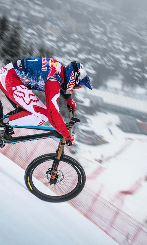 Mountain biker Max Stöckl drops into the famous Streif.
