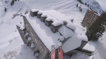 POV shot of Valentin Delluc speedriding above the roofs of the Avoriaz ski station in France.