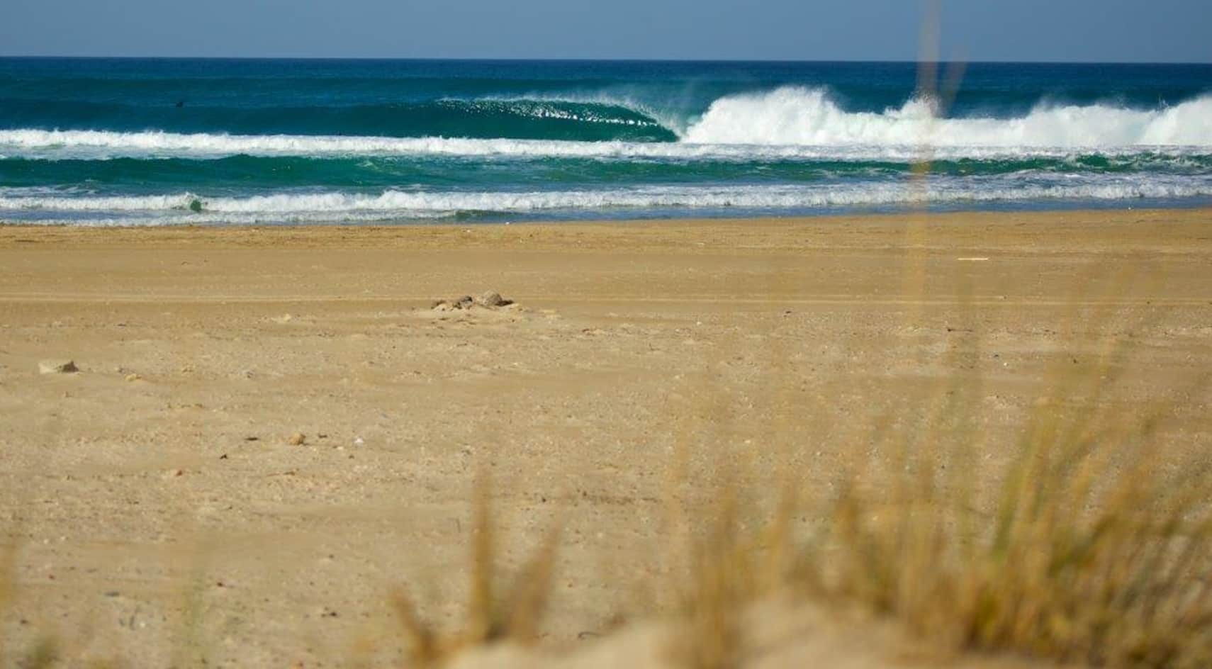 Empty waves peel on a beach in Israel.