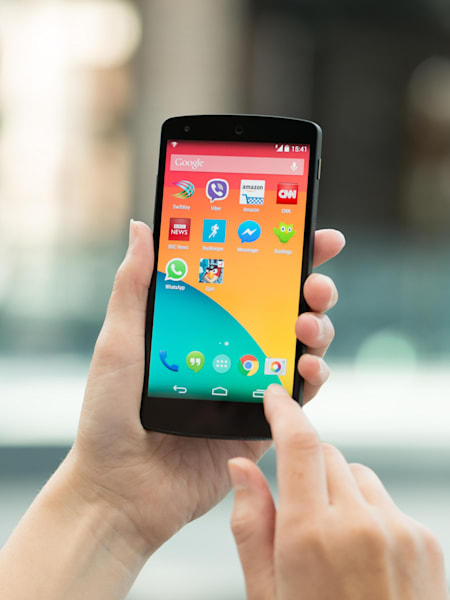 A woman uses an Android phone.