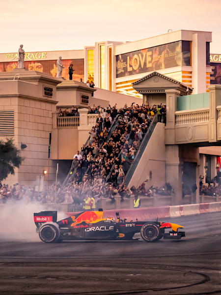 Spectators watch as Sergio Pérez drives at the Las Vegas Grand Prix Launch Party in November 2022.