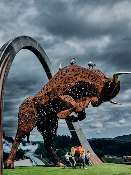 Martin Grubinger performs Drum the Bull on the steel Bull of Spielberg, in Austria, alongside Cameron Carpenter and other musicians for a special composition celebrating of the return of Formula One.