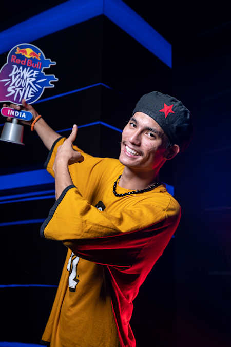 Nepo poses for a portrait with the winner trophy at Red Bull Dance Your Style in Mumbai, India, on October 16, 2021.
