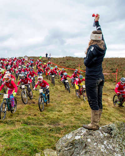 Rachel blasts the horn to start the race