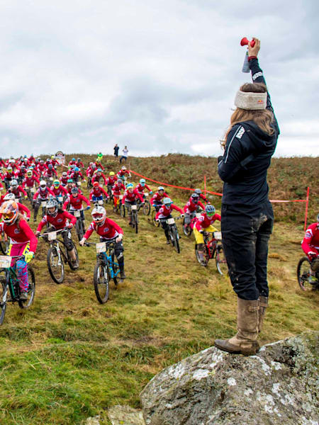 Rachel blasts the horn to start the race