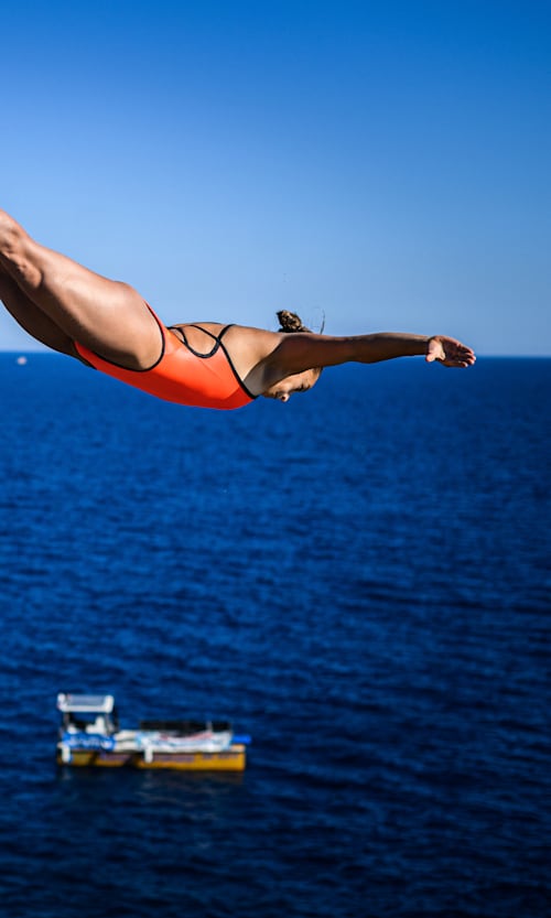 Nelli Chukanivska dives gracefully from the Antalya cliffs during the penultimate stop of the 2024 Red Bull Cliff Diving World Series