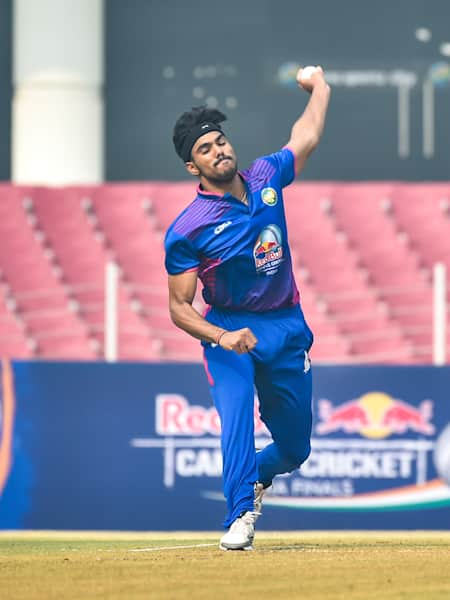 A fast bowler bowls during a match at the national finals of Red Bull Campus Cricket.