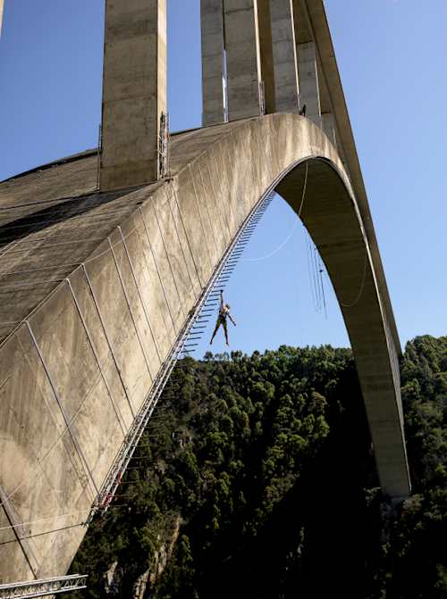 Climber and obstacle course athlete Thomas van Tonder hangs from the Bloukrans Bridge in South Africa for his record breaking event Red Bull Bridge Bars 2026