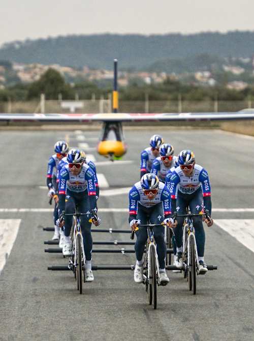 Red Bull-BORA-hansgrohe pro cycling team pictured towing a glider to flight during their Peloton Takeoff project in San Bonnet, Mallorca.