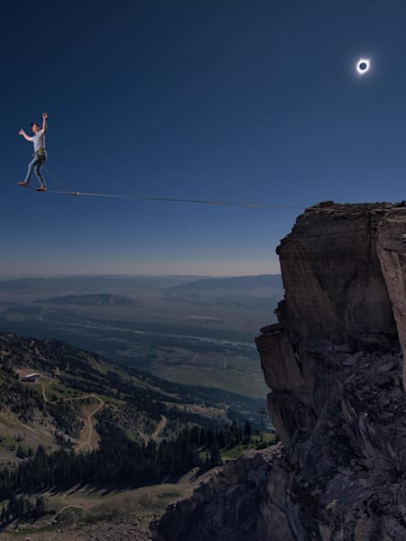 Alex Mason walks the slackline at Jackson Hole Mountain Resort during the solar eclipse in the USA in August 2017.