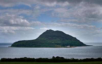 Holy Isle pictured in the distance from the Isle of Arran