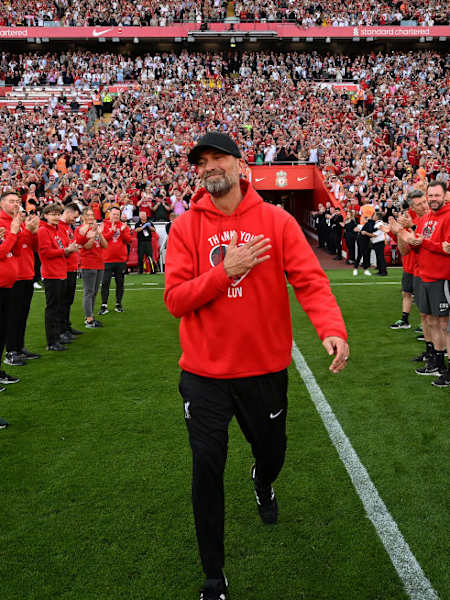 Jürgen Klopp receives a guard of honour from players during his final home game in charge of Liverpool FC.