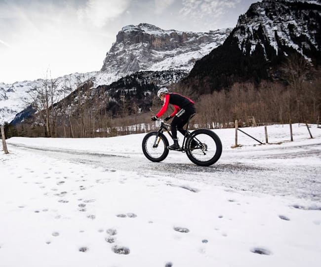 riding mountain bike in snow