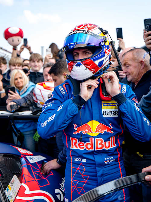 Max Verstappen clips into his race helmet ahead of the ADAC Nürburgring Langstrecken-Serie in March 2026