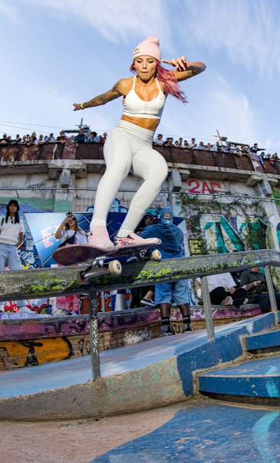 Brazil's Leticia Bufoni locks into a Monty Grind  to the approval of the skaters assembled for the Marseille stop of the Red Bull Drop In Tour