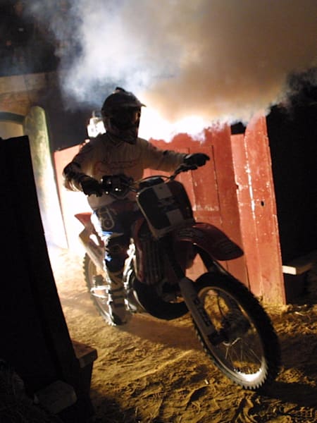 American freestyle motocross enters Valencia Plaza de Toros de Valencia in a plume of smoke for the inaugural Red Bull X-Fighters event.