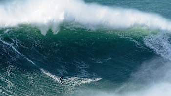 Surfer Sebastian Steudtner drops into a big wave at Nazare