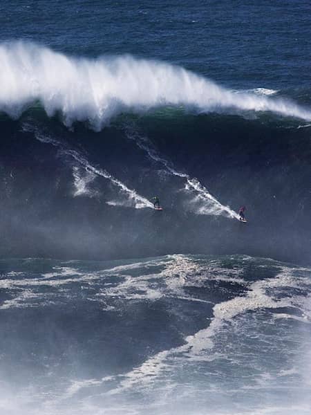 Carlos Burle takes the deep line at huge Praia do Norte.