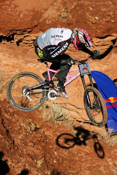 The short and compact frame nearly has Gracia’s knees hit the bars while trying to throw tricks. Newer, longer bikes mean more room in the cockpit and more stability when pointing down steep terrain.