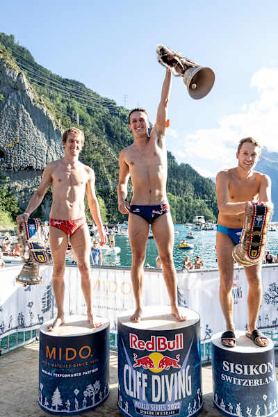 (L-R) Gary Hunt, Aidan Heslop and James Lichtenstein on the podium during the sixth stop of the Red Bull Cliff Diving World Series in Sisikon, Switzerland on September 11, 2022.