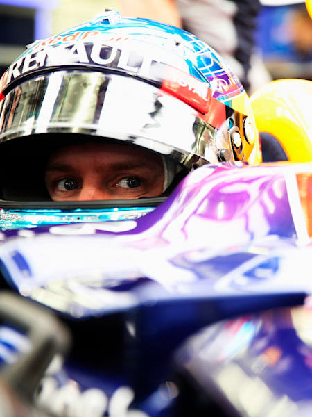 Sebastian Vettel prepares to drive during day one of Formula One Winter Testing at the Bahrain International Circuit in Bahrain on February 19, 2014.