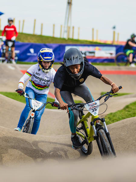 Khothalang Leuta and Payton Ridenour ride in tandem on the track.