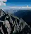 Flying high, surrounded by epic peaks.