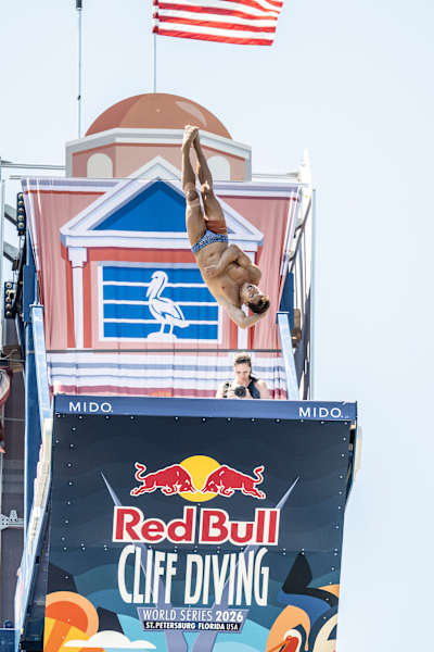 Constantin Popovici of Romania dives from the 27 metre platform at Red Bull Cliff Diving World Series 2026 in Saint Petersburg, USA, capturing the thrill of extreme sports in June