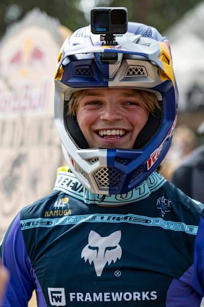 In 2025, Asa Vermette is ready for action at Red Bull Hardline, Maydena Bike Park, Tasmania, sporting a GoPro and signature Red Bull helmet among world-class riders.