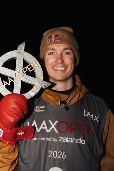 Scotty James proudly holds his Snowboard Halfpipe trophy at the Laax Open 2026 in Laax, Switzerland.