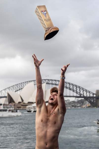 In 2024, Aidan Heslop triumphantly tosses the trophy skyward in Sydney