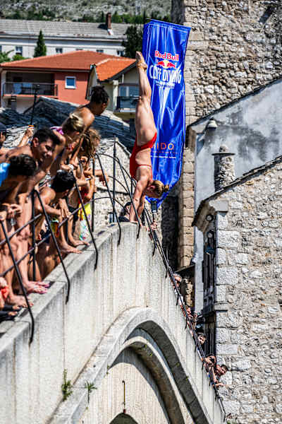 Annika Bornebusch of Denmark launches an armstand dive from the 21 metre Stari Most (Old Bridge) during the first competition day of the Red Bull Cliff Diving World Series in Mostar September 7 2023.