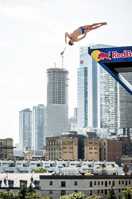 In 2024, Gary Hunt dives acrobatically at Red Bull Cliff Diving event in Montreal.