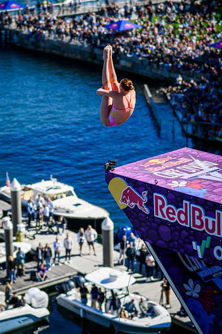 Molly Carlson of Canada performs a spectacular dive from the 21-metre platform atop Boston's Institute of Contemporary Art at the Red Bull Cliff Diving World Series 2025 final stop