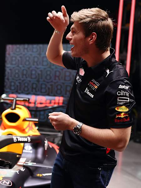 Max Verstappen and Sergio Pérez in a good mood in front of the Red Bull Racing car