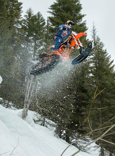Robbie Maddison getting comfortable on his snow bike in the Idaho backcountry.