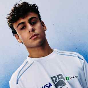 Arvid Lindblad models the Visa Cash App Racing Bulls Core Monobrand Collection in Milton Keynes, UK.