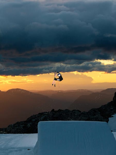 Freeskier Mac Forehand jumping off a kicker during filming for Faction Ski's film The Collective.