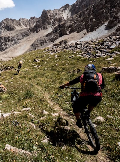 Rene Wildhaber and Tom Oehler descend from the 4303m Sary Mogol Pass, on August 16, 2018 during an 8 Day mountain bike traverse of Kyrgyzstan's Alai Mountains.
