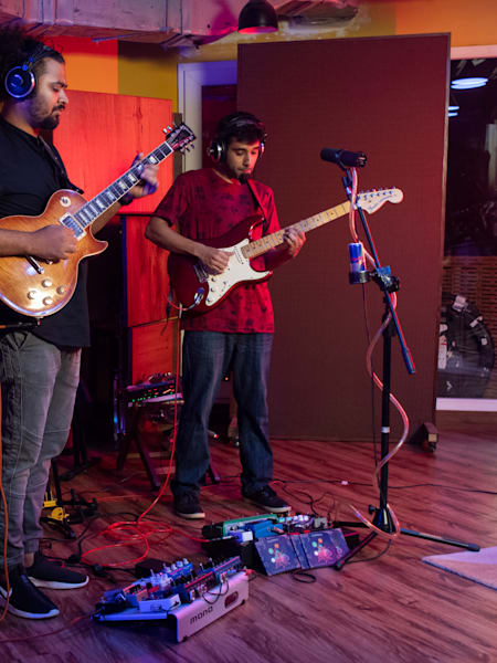 Members of the band Jatayu peform in a recording studio.