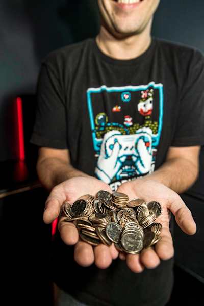 GrandPOObear offers up some arcade tokens.