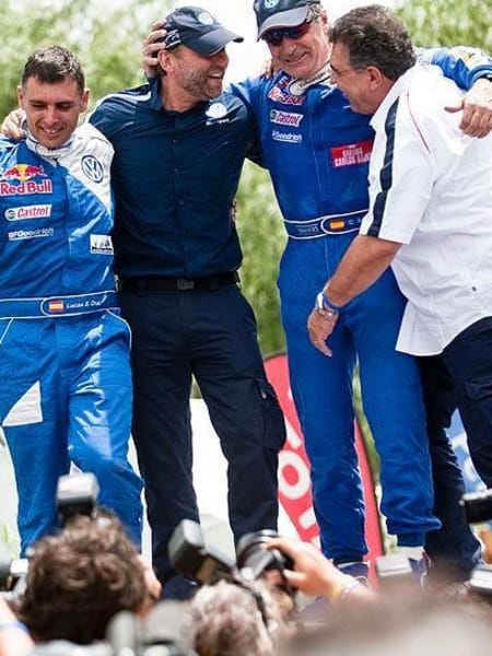 Carlos Sainz and co-driver Lucas Cruz celebrate winning the 2010 Dakar Rally
