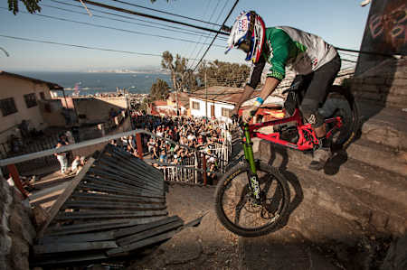 A MTB athlete racing at the Red Bull Valparaiso Cerro Abajo urban downhill race in Chile.