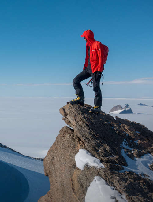 Cedar Wright stands on top of a mountain (Reel Rock) – climbing