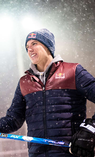 Mitch Marner on an outdoor rink at night during a snowstorm 